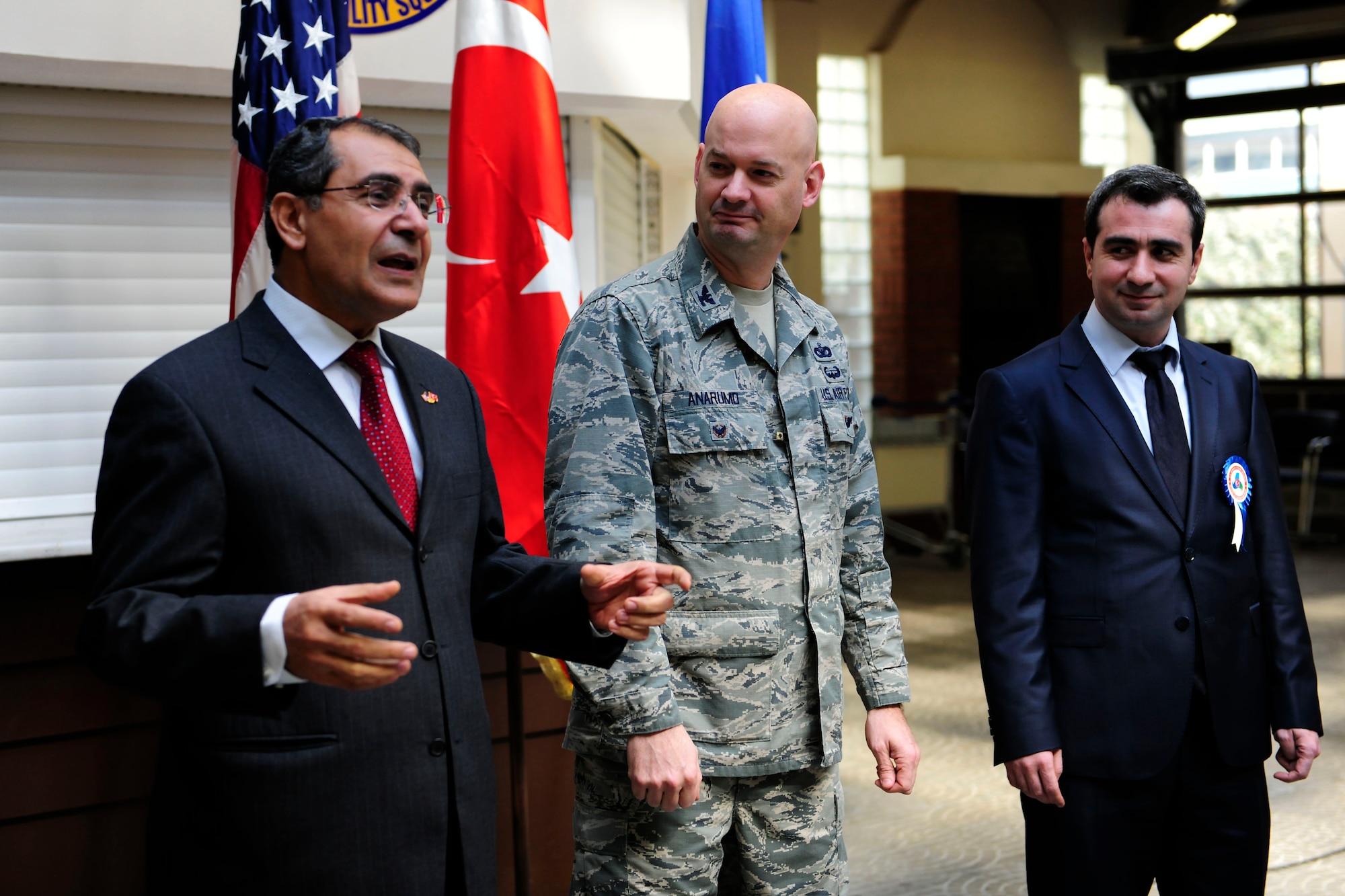 Mehmet Birbiri (left), 39th Air Base Wing host nation advisor, translates for Col. Mark Anarumo, 39th ABW vice commander, and Kerem Korkamz, Ministry of Customs and Trade Incirlik customs Director, as they give speeches during an International Customs Day luncheon Jan. 26, 2015, at Incirlik Air Base, Turkey. The luncheon was the first-ever International Customs Day event held by the 39th ABW. (U.S. Air Force photo by Senior Airman Krystal Ardrey/Released)
