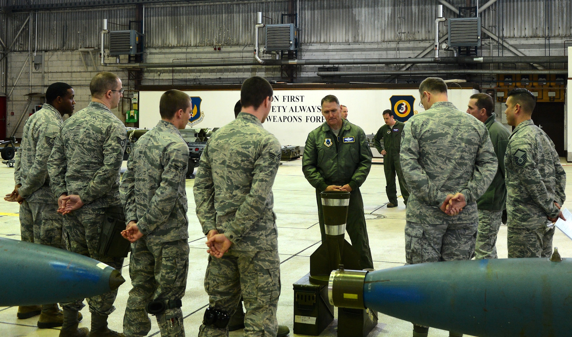 Airmen from the 52nd Maintenance Group gather in Hangar 1 during a visit from U.S. Air Force Maj. Gen. Kurt Neubauer, Air Force Chief of Safety, at Spangdahlem Air Base, Germany, Jan. 23, 2015. Neubauer spent the day visiting various locations around base to evaluate safety procedures and meet with Airmen. (U.S. Air Force photo by Airman 1st Class Luke Kitterman/Released)