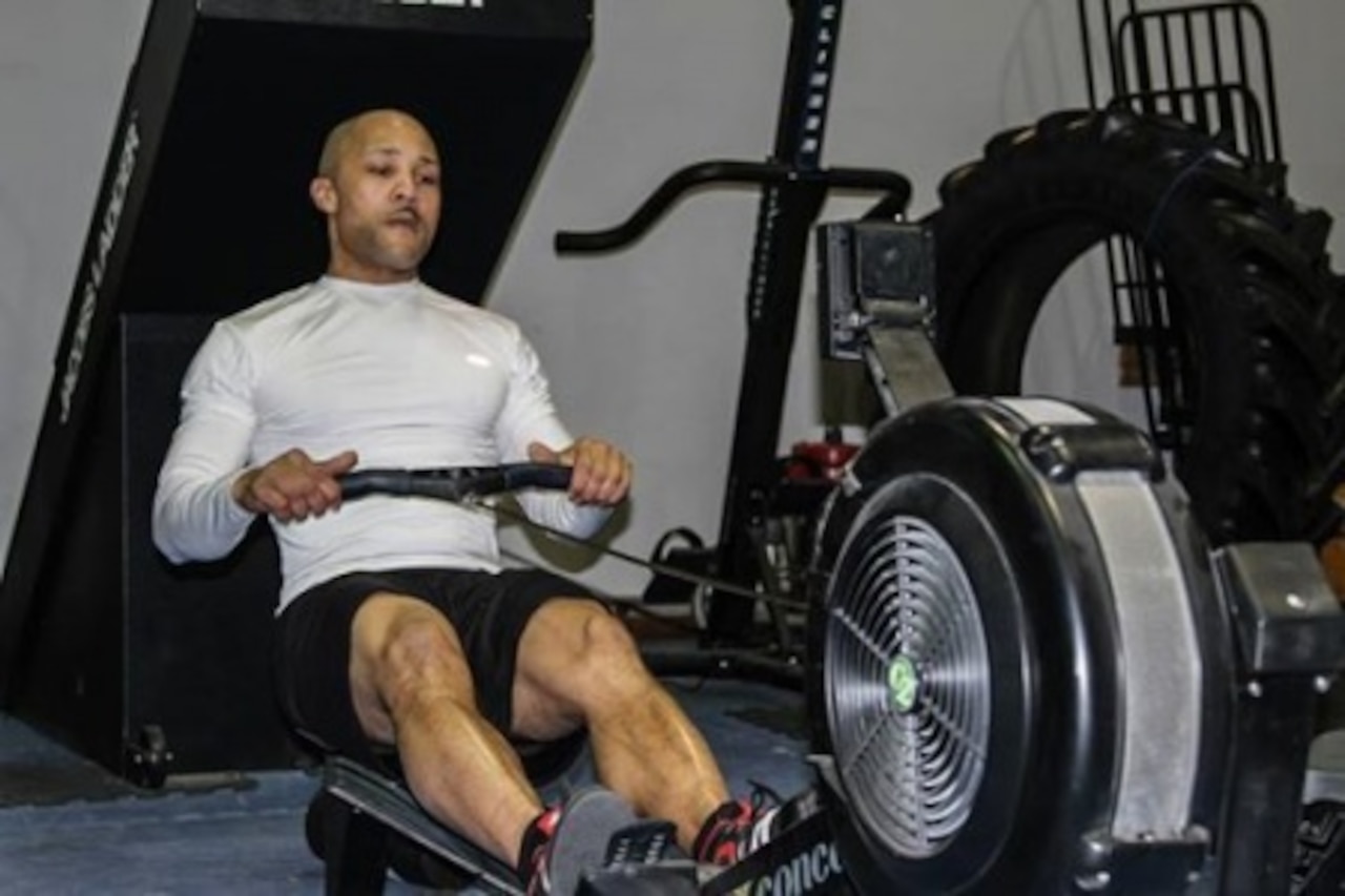 Army Sgt. 1st Class Bryan Vann, the noncommissioned officer in charge of the communications section for the 2nd Combat Aviation Brigade, 2nd Infantry Division, warms up to perform a crossfit workout at the fitness annex on Camp Humphreys, South Korea, Jan. 28, 2015. U.S. Army photo by Sgt. Jesse Smith