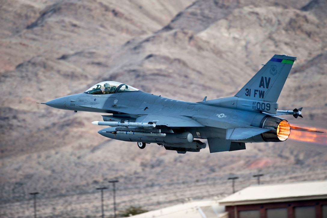 A U.S. Air Force F-16 Fighting Falcon aircraft launches during Red Flag 15-1 on Nellis Air Force Base, Nev., Jan. 26, 2015. The pilot and aircraft are assigned to the 555th Fighter Squadron, Aviano Air Base, Italy. Red Flag provides a series of intense air-to-air scenarios for aircrew and ground personnel to increase their combat readiness and effectiveness for future real-world operations.