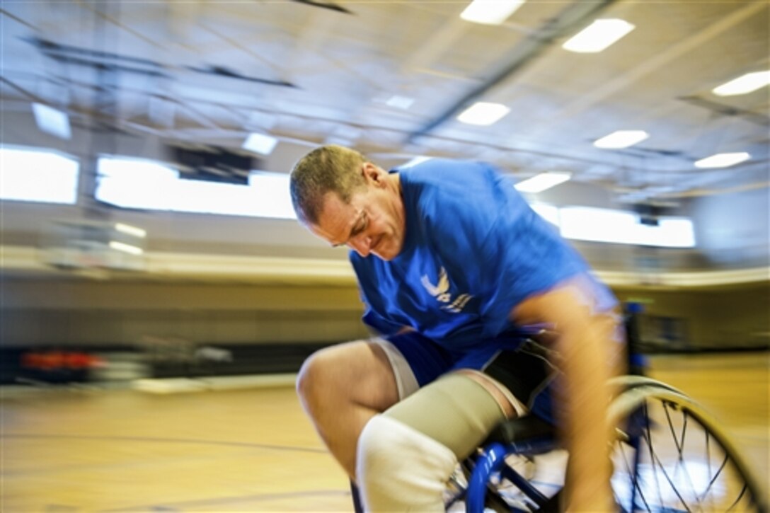A recovering airman practices drills at wheelchair basketball during the Wounded Warrior Adaptive Sports and Reconditioning Camp on Joint Base San Antonio-Randolph, Texas, Jan. 20, 2015. More than 80 recovering airmen from around the nation participated in the weeklong adaptive sports camp.  