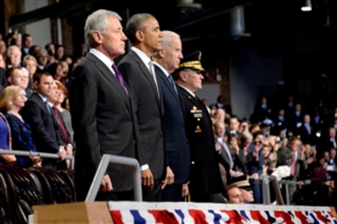 Defense Secretary Chuck Hagel, far left, President Barack Obama, Vice President Joe Biden and Army Gen. Martin E. Dempsey, chairman of the Joint Chiefs of Staff, stand during the Armed Forces Farewell Tribute to Hagel on Joint Base Myer-Henderson Hall in Arlington, Va., Jan. 28, 2015. Obama hosted the event for Hagel, the 24th defense secretary. 