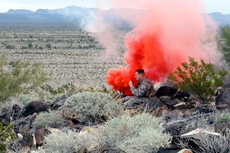 150129-Z-VA676-111 – An Airman from the 127th Operations Support Squadron waits to be rescued during a combat search and rescue exercise in the Barry M. Goldwater Air Force Range, west of Tucson, Ariz., Jan. 29, 2015. The 107th Fighter Squadron and related elements of the 127th Wing are participating in a series of training exercises known as Snowbird, while at the Total Force Training Center at Davis-Monthan Air Force Base. The 107th flies the A-10 Thunderbolt II and is assigned to Selfridge Air National Guard Base, Mich. (U.S. Air National Guard photo by Tech. Sgt. Dan Heaton)