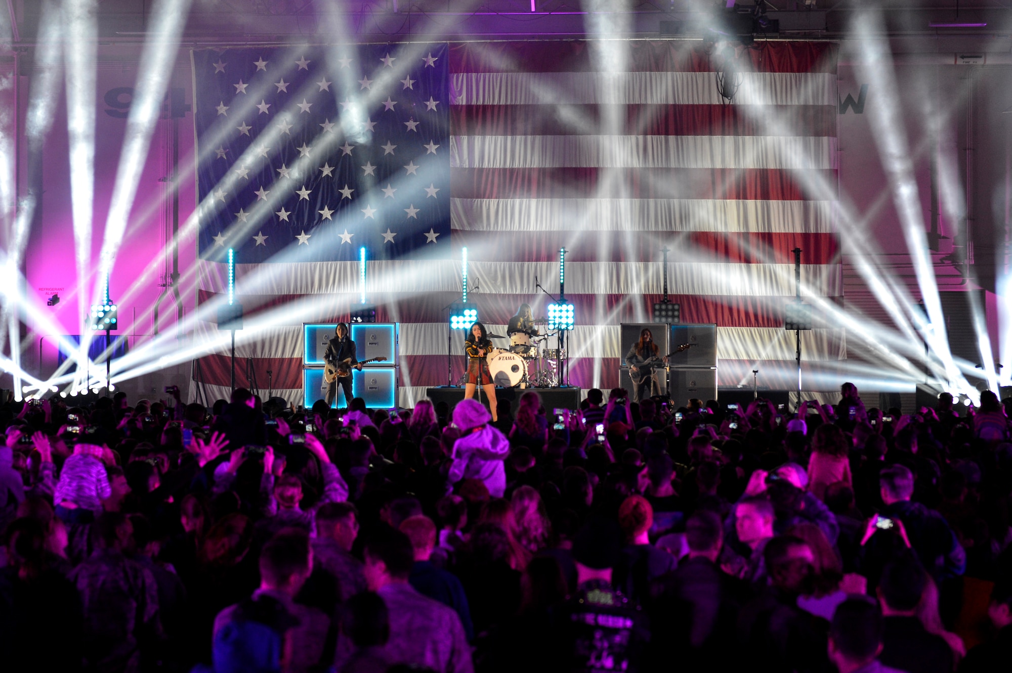Airmen gather around the stage to watch Charli XCX for the VH1 concert at Luke Air Force Base, Arizona, Jan. 30, 2015. The concert for the troops event was hosted by Nick Lachey in Hangar 999 at Luke. (U.S. Air Force photo by Airman Pedro Mota)
