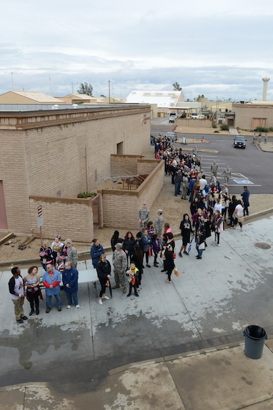 Airmen and their friends wait in line for the VH1 concert at Hangar 999 at Luke Air Force Base, Arizona, Jan. 30, 2015. Thousands of Thunderbolts came out to see Fall Out Boy and Charli XCX. (U.S. Air Force photo by Senior Airman James Hensley)