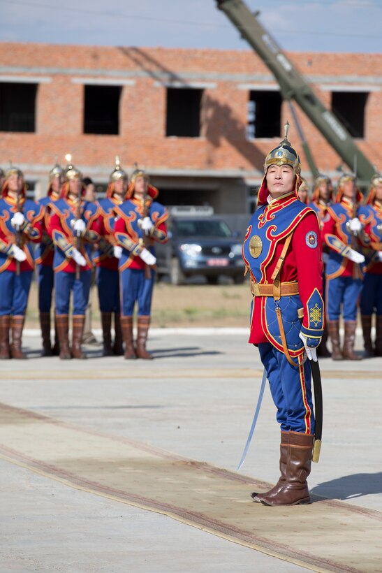 A Mongolian Armed Forces soldier stands at attention during the Khaan Quest 2015 closing ceremony held in Tavantolgoi, Mongolia, July 1, 2015. Khaan Quest is a regularly scheduled, multinational exercise hosted annually by Mongolian Armed Forces and co-sponsored by U.S. Army Pacific, and U.S. Marine Corps Forces, Pacific. This year marks the 13th iteration of Khaan Quest.