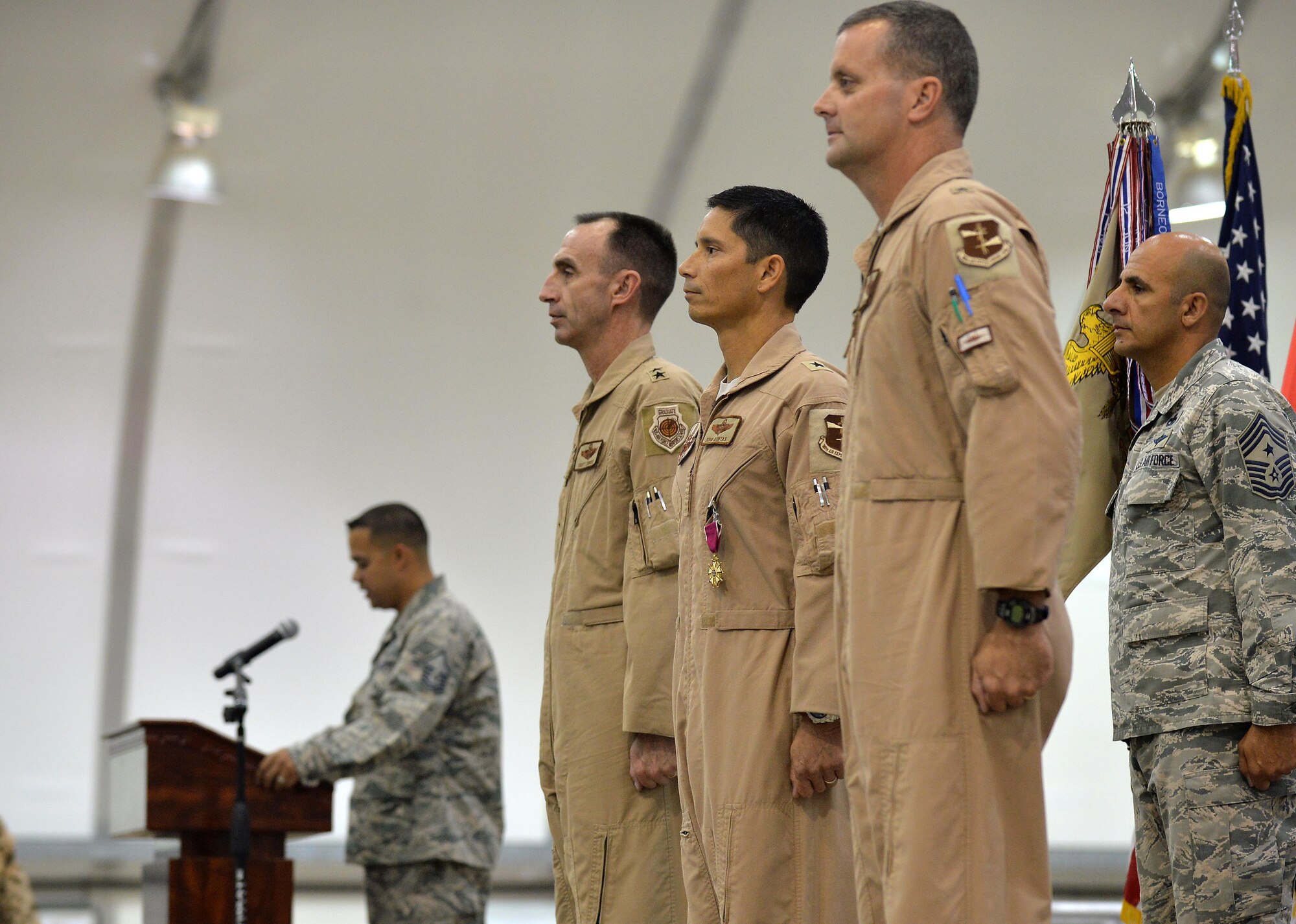 Maj. Gen. Scott Zobrist, Air Force Central Command deputy commander, center-left, Brig. Gen. John Quintas, center, and Brig. Gen. Daniel Orcutt, center-right, prepare for the change in command at an undisclosed location in Southwest Asia June 30, 2015. Several hundred U.S. Airmen, Soldiers and other coalition personnel attended the ceremony to the honor the outgoing and incoming commanders. (U.S. Air Force photo/Tech. Sgt. Jeff Andrejcik)