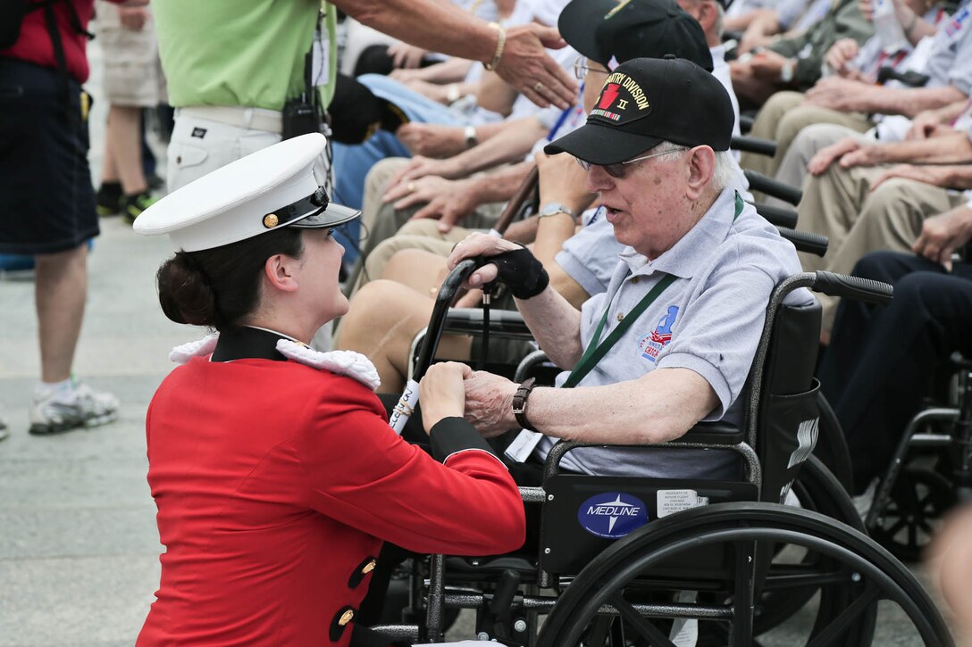 Members of "The President's Own" U.S. Marine Band supported a ceremony for World War II veterans with Honor Flight Chicago on June 30, 2015, at the National World War II Memorial. (USMC photo by Staff Sgt. Brian Rust/released)