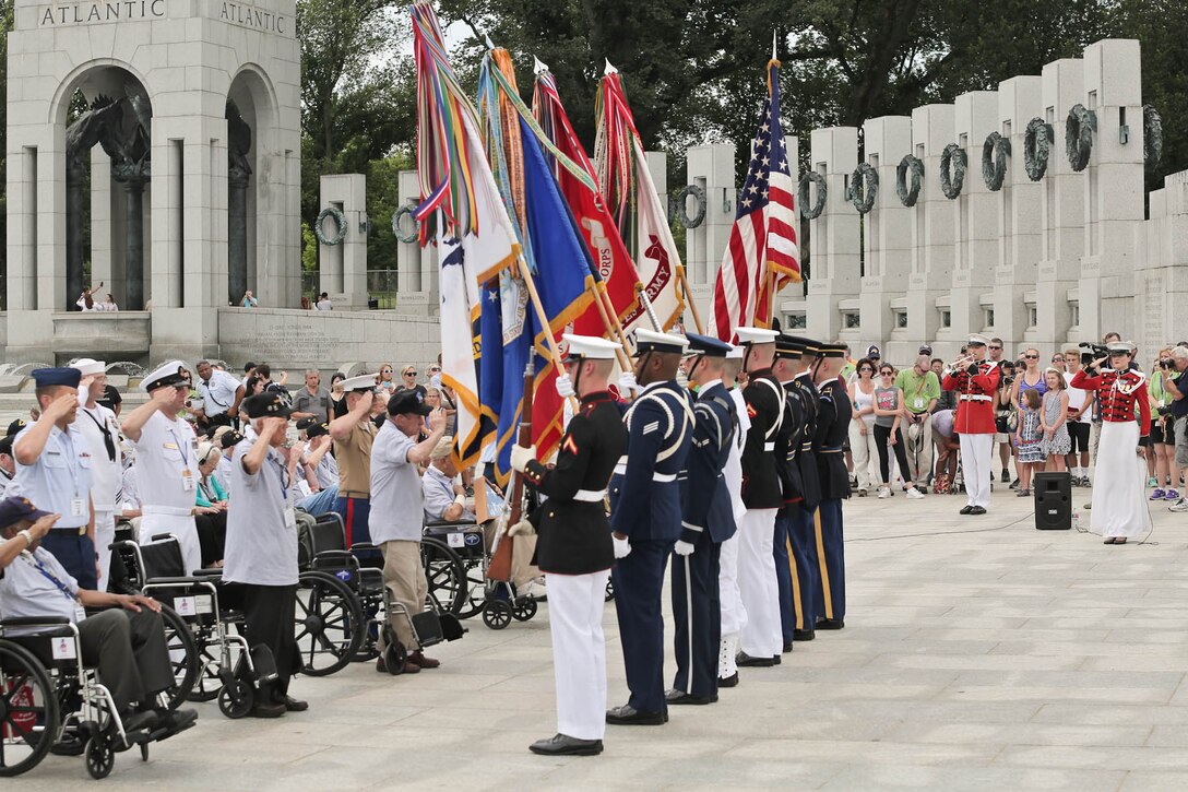 Members of "The President's Own" U.S. Marine Band supported a ceremony for World War II veterans with Honor Flight Chicago on June 30, 2015, at the National World War II Memorial. (USMC photo by Staff Sgt. Brian Rust/released)