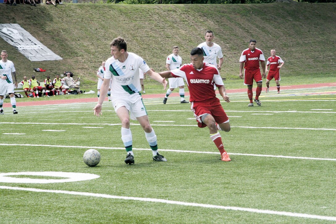 Mid-fielder Patino and Striker May fighting for possession of the soccer ball at Butler Stadium on June 23. The Soccer match ended in a loss for Quantico with a final score of 12-0.