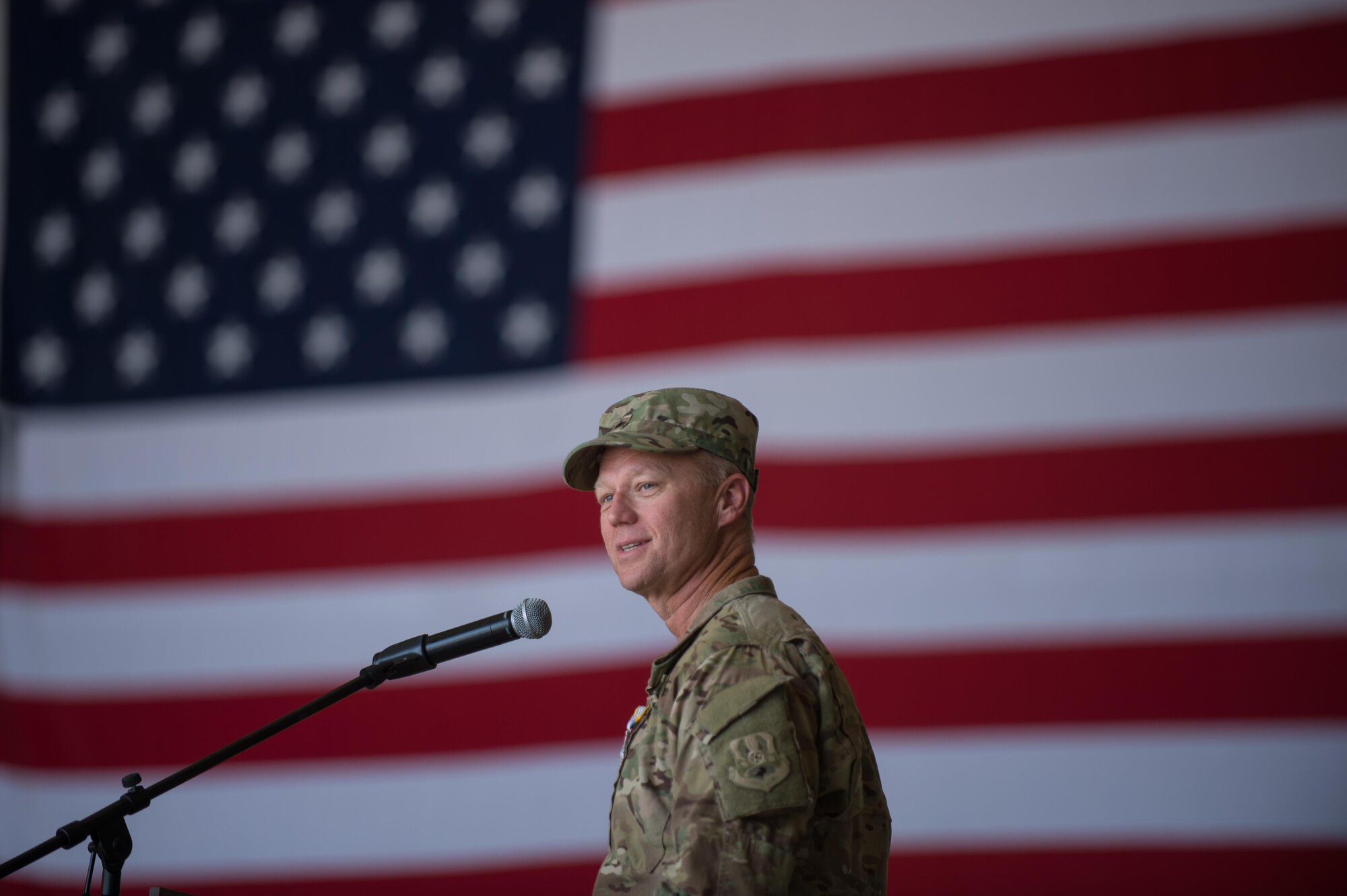 U.S. Air Force Brig. Gen. Mark Kelly, 455th Air Expeditionary Wing commander, speaks during the 455th AEW change of command ceremony July 1, 2015, at Bagram Airfield, Afghanistan. During the ceremony Kelly relinquished command of the 455th AEW to Brig. Gen. Dave Julazadeh.  (U.S. Air Force photo by Tech. Sgt. Joseph Swafford/Released)