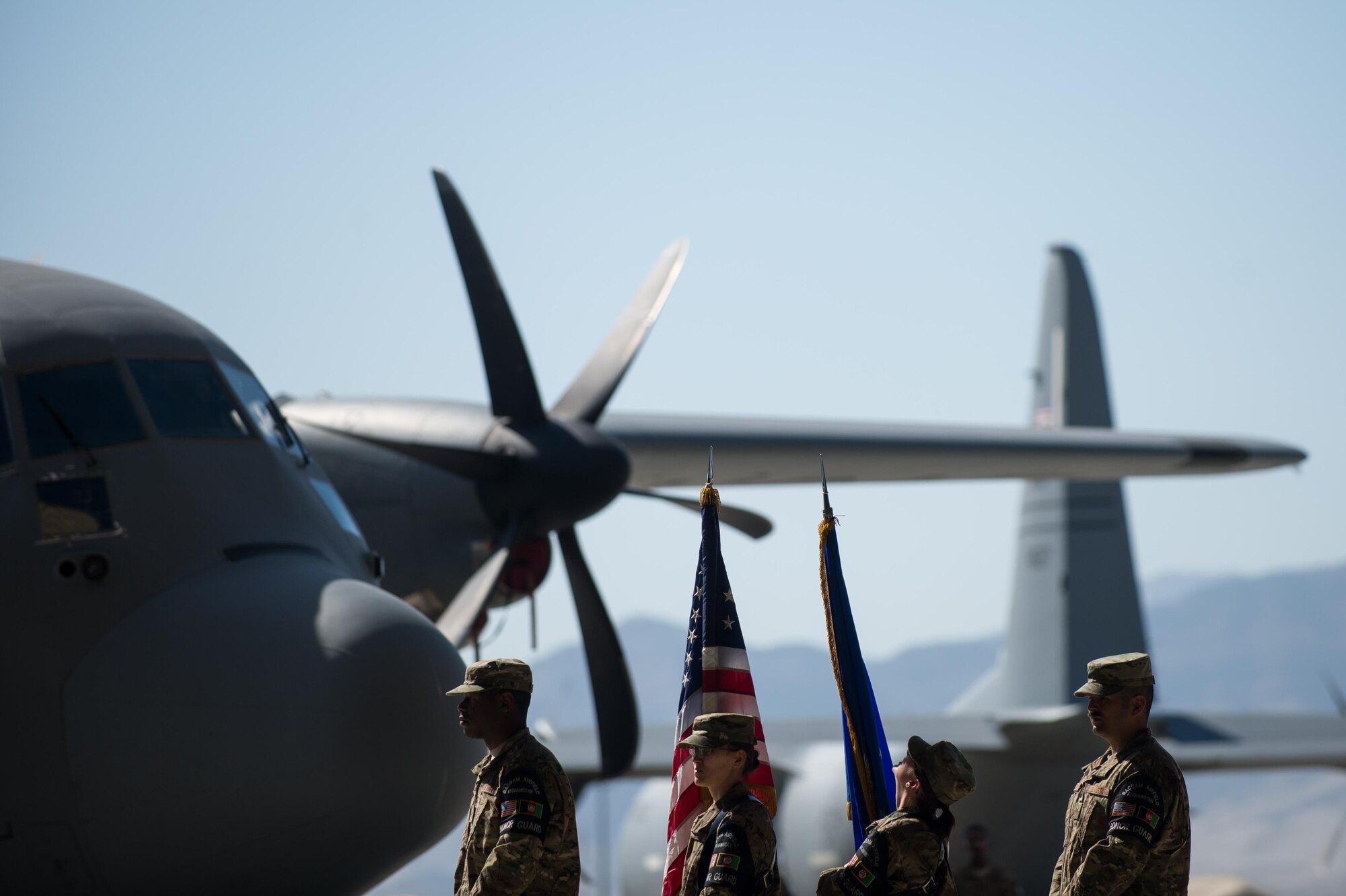 U.S. Airmen with the Bagram Airfield Honor Guard make last minute adjustments before the 455th Air Expeditionary Wing change of command ceremony at Bagram Airfield, Afghanistan, July 1, 2015. During the ceremony Kelly relinquished command of the 455th AEW to Brig. Gen. Dave Julazadeh.  (U.S. Air Force photo by Tech. Sgt. Joseph Swafford/Released)