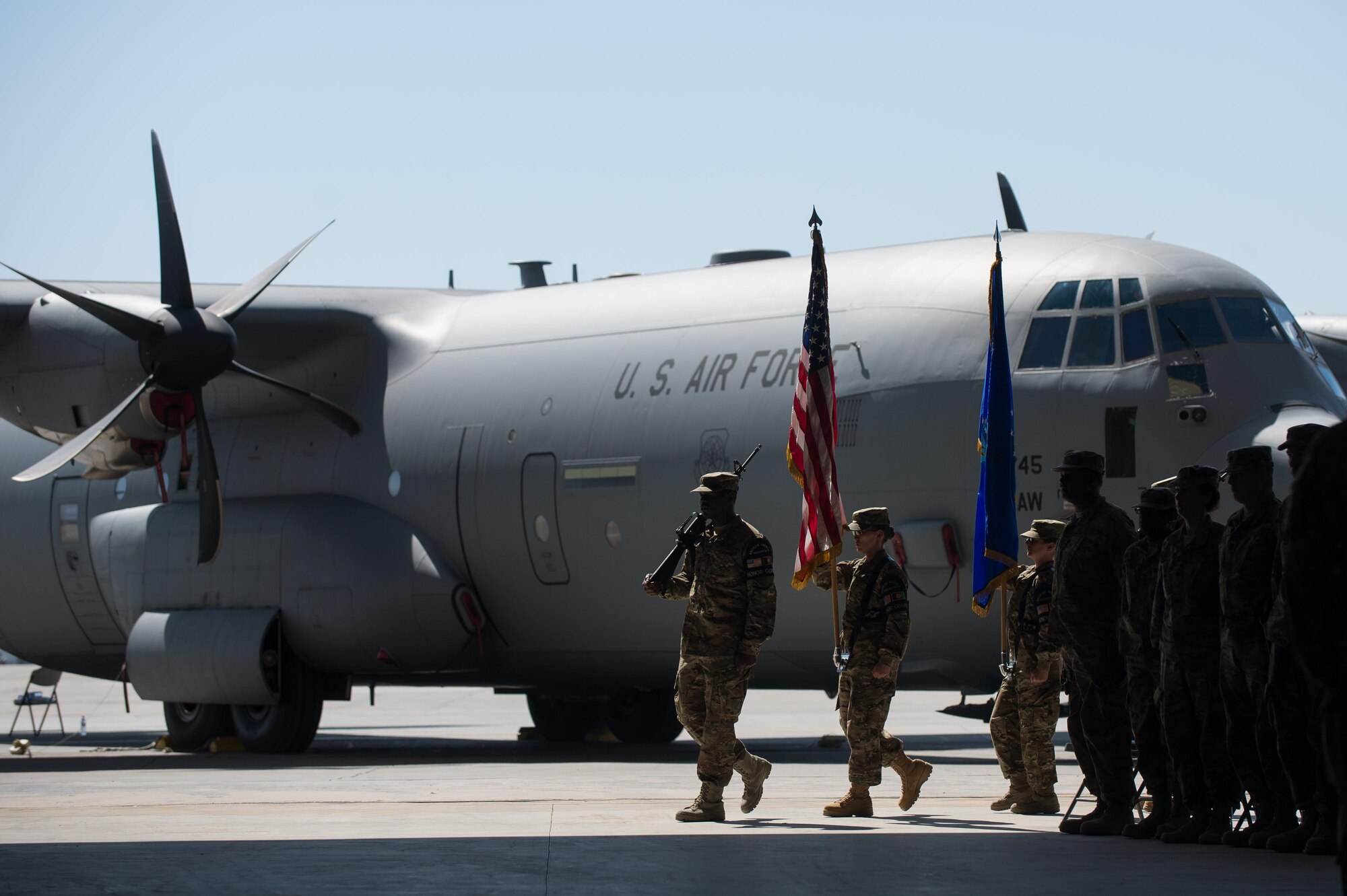 U.S. Airmen with the Bagram Airfield Honor Guard march with the colors during the 455th Air Expeditionary Wing change of command ceremony at Bagram Airfield, Afghanistan, July 1, 2015. During the ceremony Kelly relinquished command of the 455th AEW to Brig. Gen. Dave Julazadeh.  (U.S. Air Force photo by Tech. Sgt. Joseph Swafford/Released)