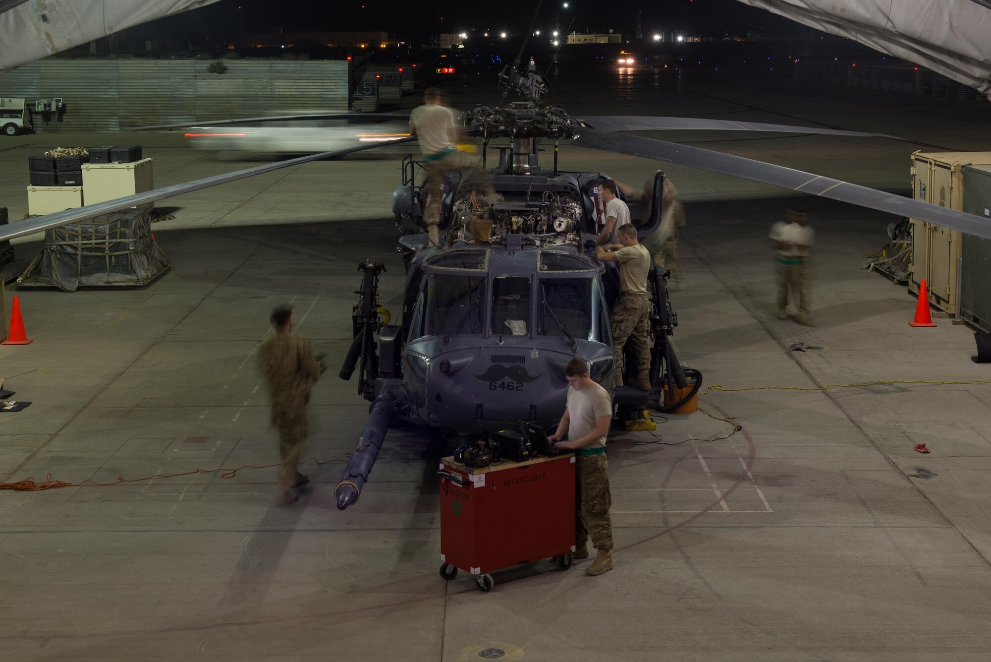 U.S. Airmen assigned to the 41st Expeditionary Helicopter Maintenance Unit, 455th Expeditionary Aircraft Maintenance Squadron, work to complete a 50 hour inspection on a HH-60 Pave Hawk helicopter at Bagram Airfield, Afghanistan, June 28, 2015. The 41st EHMU ensure Pave Hawks on Bagram are prepared for flight and return them to a mission-ready state once they land.  (U.S. Air Force photo by Tech. Sgt. Joseph Swafford/Released)