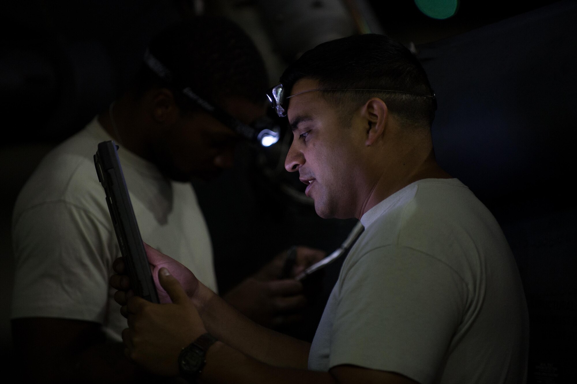 U.S. Air Force Tech. Sgt. Victor Garza, 41st Expeditionary Helicopter Maintenance Unit HH-60 Pave Hawk helicopter avionics expediter, completes a 50 hour inspection on a Pave Hawk at Bagram Airfield, Afghanistan, June 28, 2015. The 41st EHMU ensure Pave Hawks on Bagram are prepared for flight and return them to a mission-ready state once they land.  (U.S. Air Force photo by Tech. Sgt. Joseph Swafford/Released)