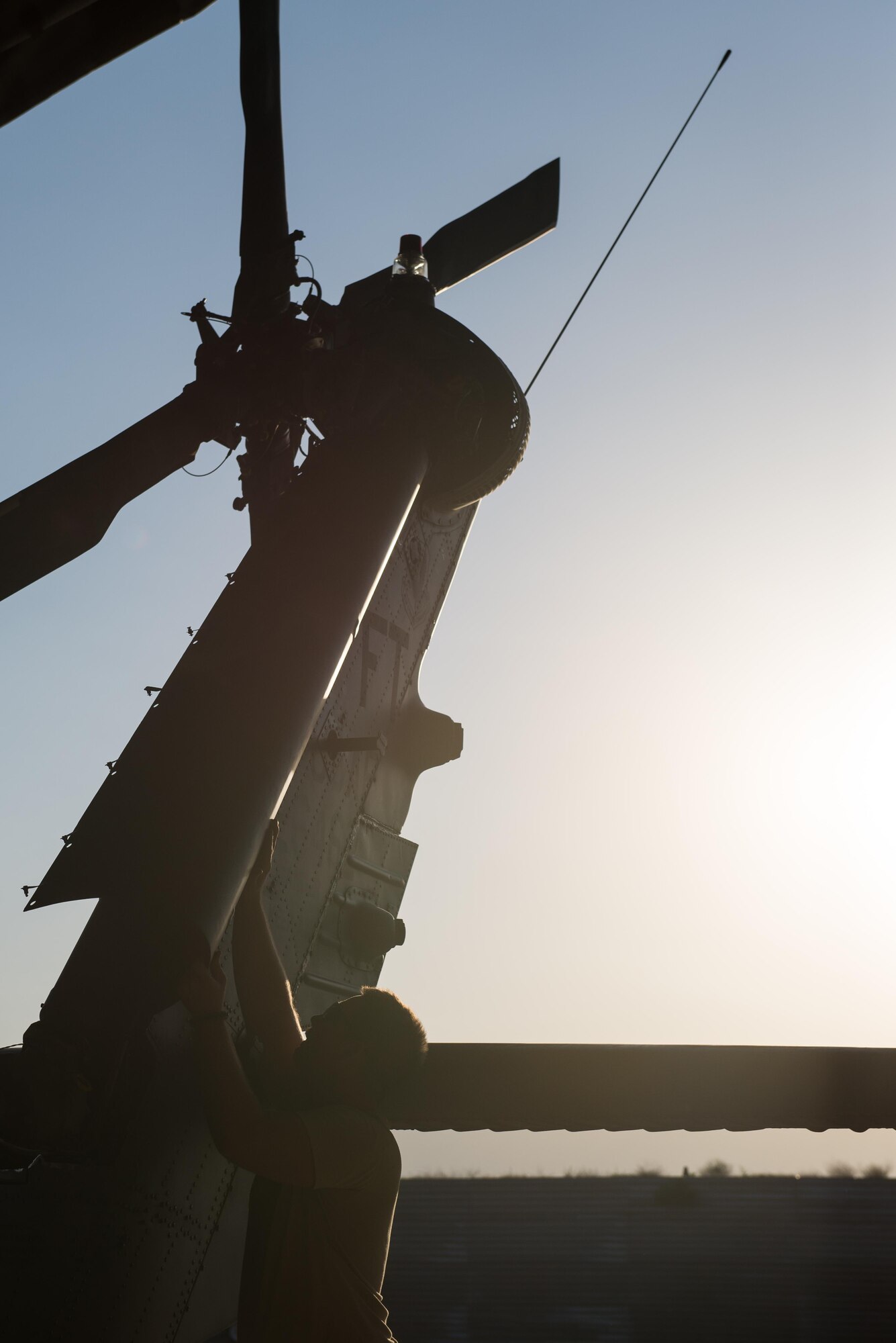 U.S. Air Force Senior Airman Joseph Roberts, 41st Expeditionary Helicopter Maintenance Unit crew chief, works to complete a 50 hour inspection on a HH-60 Pave Hawk helicopter at Bagram Airfield, Afghanistan, June 28, 2015. The 41st EHMU ensure Pave Hawks on Bagram are prepared for flight and return them to a mission-ready state once they land.  (U.S. Air Force photo by Tech. Sgt. Joseph Swafford/Released)