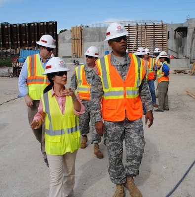 Eva Porras (left), Construction Engineer with the U.S. Army Corps of Engineers (USACE) Herbert Hoover Dike Resident Office, shows USACE South Atlantic Division Commander Brig. Gen. David Turner (right) some key features of a culvert replacement project near Canal Point, Fla. USACE is working to replace 26 culverts which are seen as posing the biggest risk to the integrity of the dike; 16 of those culverts are currently under contract, with contract awards on the remaining 10 expected over the next four years.