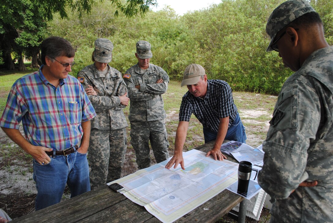 Dr. Paul Gray (second from right), science coordinator for Audubon Florida, talks about the environmental benefits of Kissimmee River Restoration projects to senior leaders from the U.S. Army Corps of Engineers (USACE) South Atlantic Division and Jacksonville District. Also pictured are Tim Murphy, USACE Jacksonville District Deputy Engineer for Programs and Project Management, Lt. Col. Jennifer Reynolds, USACE Jacksonville District Deputy Commander for south Florida, Col. Alan Dodd, USACE Jacksonville District Commander, and Brig. Gen. David Turner, USACE South Atlantic Division Commander.