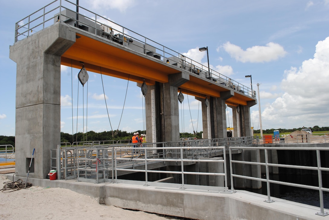 The U.S. Army Corps of Engineers is nearing completion of the S-65EX1 spillway on the Kissimmee River near Okeechobee.The spillway is expected to be finished later this year and is a key flood protection feature of the river restoration project.