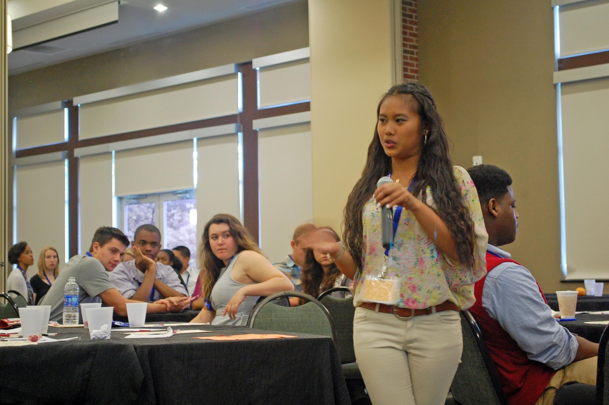 Nicole Anne Basaca, winner for the installation-level Youth of the Year competition for Travis AFB, California, explains her group's puzzle question during a leadership discussion, June 24. Installation-level winners from 51 Air Force bases around the world gathered in San Antonio June 22-26, 2015, for the Youth of the Year Youth Leadership Camp, run through a partnership between Air Force Youth Programs and the Boys & Girls Club of America. The week-long event included leadership development and team-building exercises and offered participants the chance to connect with like-minded peers. (U.S. Air Force photo/Master Sgt. Christian Michael/RELEASED)