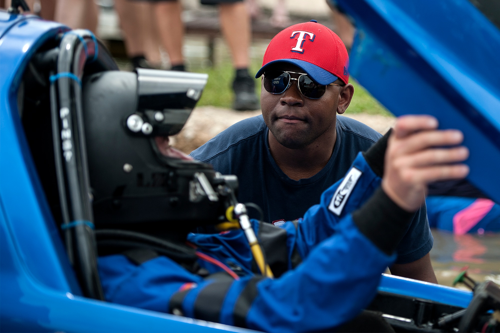 U.S. Air Force 2nd Lt. Adetunji A. Fisayo, Goodfellow Air Force Base 315th Training Squadron student, right, assists Rick Allen, driver of “Total Kaos”, into the water during the 2015 Showdown in San Angelo Super Nationals drag boat races at Lake Nasworthy in San Angelo, Texas, June 27. Fisayo guided Allen down the boat ramp to prevent damaging the boat’s exterior. (U.S. Air Force photo by Airman 1st Class Devin Boyer/Released)