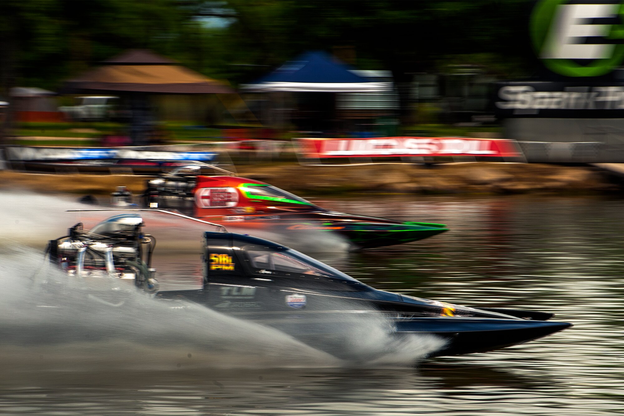 Drag boats race in a liquid quarter mile during the 2015 showdown in San Angelo Super Nationals drag boat races at Lake Nasworthy in San Angelo, Texas, June 27. The San Angelo Chamber of Commerce runs the event with the help of Goodfellow Air Force Base volunteers. (U.S. Air Force photo by Airman 1st Class Devin Boyer/Released)