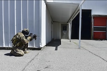 Senior Airman  Jason Fernandez, 1st Special Operations Security Forces Squadron Deployed Aircraft Ground Response Element, provides security during a field training exercise in Fort Walton Beach, Fla., June 19, 2015. The FTX simulated the DAGRE team escorting a finance specialist to make a transfer of funds. (U.S. Air Force photo/Senior Airman Jeff Parkinson)