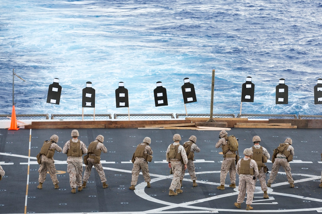 U.S. Marines with Company F, Battalion Landing Team 2nd Battalion, 5th Marine Regiment, 31st Marine Expeditionary Unit, conduct a live fire exercise with Japanese Ground Self Defense-Force soldiers with the Western Army Infantry Regiment, on the flight deck of the USS Green Bay, at sea, June 16, 2015. The 31st MEU is currently conducting its annual Fall Patrol of the Asia-Pacific region.