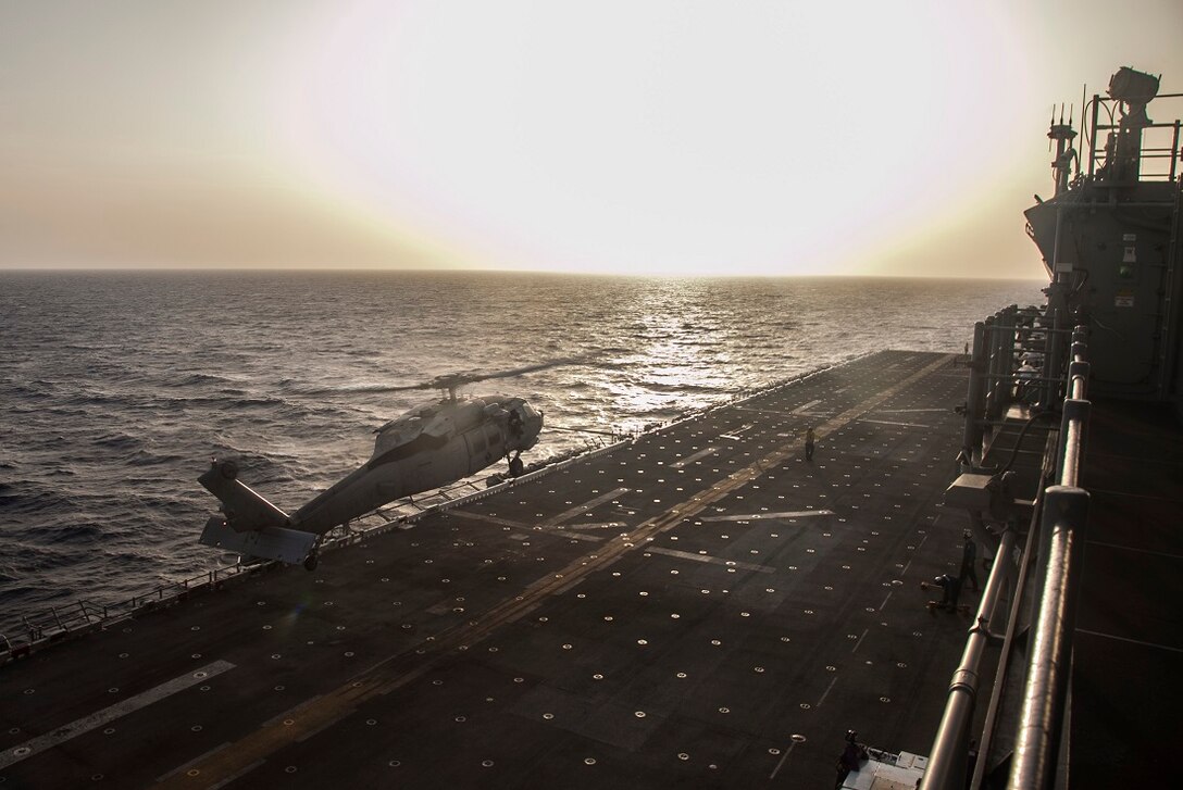 GULF OF ADEN (June 28, 2015) A U.S. Navy MH-60S Sea Hawk from the “Blackjacks” of Helicopter Sea Combat Squadron 21, takes off from the flight deck of the amphibious assault ship USS Essex (LHD 2). The pilots maintain their flight readiness by performing take-off and landing drills. The 15th Marine Expeditionary Unit is embarked on the Essex Amphibious Ready Group and deployed to maintain regional security in the U.S. 5th Fleet area of operations. (U.S. Marine Corps photo by Cpl. Elize McKelvey/Released)