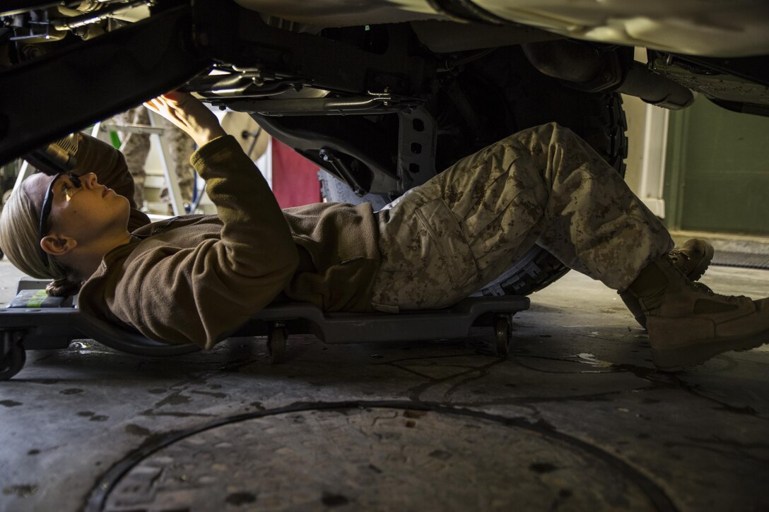 Lance Cpl. Madelyn E. Smith, an automotive organizational mechanic for Combat Logistics Battalion 451, Combat Logistics Regiment 45, 4th Marine Logistics Group, Marine Forces Reserve, inspects a high mobility multipurpose wheeled vehicle in Trondheim, Norway, June 25, 2015 during the Personnel Temporary Augmentee Program Norway 2015. CLB-451 deployed to Norway during their two-week annual training period. The detachment divided into multiple cave sites where equipment is stored in order to facilitate a simultaneous continuous workflow within each military occupational specialty while working with local Norwegian contracted logistics personnel. By maintaining strategic locations throughout Norway, the program promotes regional security, maintains national interoperability and supports rapid response to crises and contingencies throughout the continents of Europe and Africa.