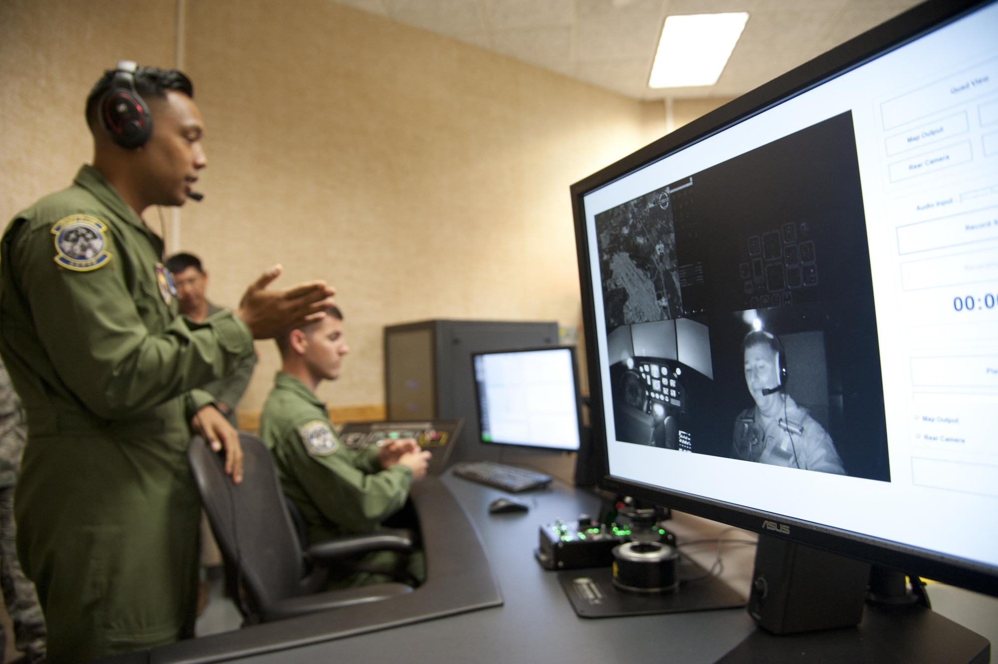 Col. John Cinnamon, the 71st Operations Group commander, visible on the screen to the right, tests Vance’s newest pilot training tool, a Spatial Disorientation Trainer, after a ribbon-cutting ceremony July 1 in Building 826, Vance Air Force Base, Oklahoma. The simulator costs $1.2 million and mimics the feeling of flying a T-6A Texan II. (U.S. Air Force photo by Staff Sgt. Nancy Falcon)