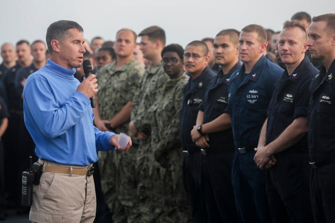 U.S. Navy Capt. Michael McKenna addresses his sailors on the forecastle of the San Antonio-class amphibious transport dock ship USS Anchorage (LPD 23).  McKenna is the commanding officer of the Anchorage. Anchorage is part of the Essex Amphibious Ready Group and, with the embarked 15th Marine Expeditionary Unit, is deployed in support of maritime security operations and theater security cooperation efforts in the U.S. 5th Fleet area of operations. (U.S. Marine Corps photo by Sgt. Jamean Berry/Released)
