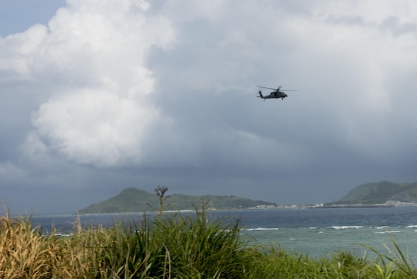 A U.S. Air Force HH-60G Pave Hawk helicopter from the 33rd Rescue Squadron flies off the coast of Okinawa, Japan, during a large force exercise June 30, 2015. The exercise, which integrated U.S. Air Force and Marine Corps assets on Okinawa, was designed to allow the units to practice air-to-air capabilities while supporting ground troops. (U.S. Air Force photo by Staff Sgt. Maeson L. Elleman/Released)