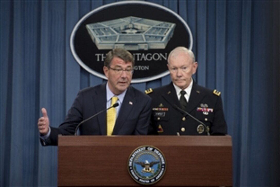 Defense Secretary Ash Carter and Army Gen. Martin E. Dempsey, chairman of the Joint Chiefs of Staff, brief reporters during a news conference at the Pentagon, July 1, 2015. 