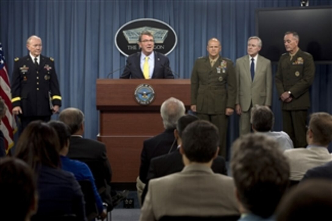 Defense Secretary Ash Carter speaks while conducting a news conference with Army Gen. Martin E. Dempsey, left, chairman of the Joint Chiefs of Staff, at the Pentagon, July 1, 2015. During the event Carter announced the president’s nomination of Lt. Gen. Robert Neller, right center, as the next Marine Corps commandant. Neller would replace Gen. Joseph Dunford, right, who has been nominated to be the next chairman of the Joint Chiefs of Staff. 