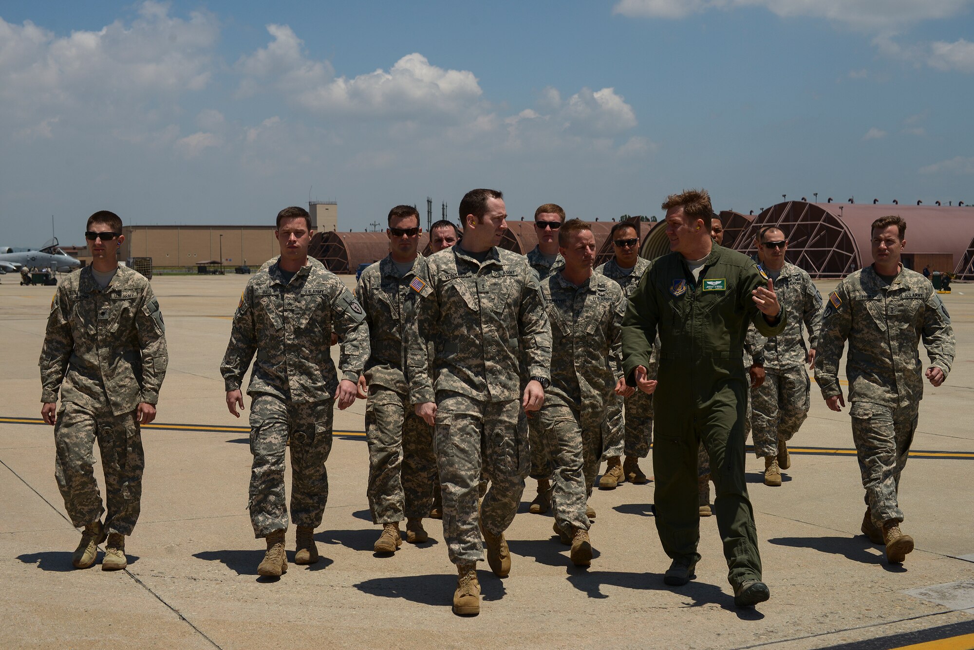 1st Lt. Jerrad O'Brien, 25th Fighter Squadron pilot, explains the A-10's capabilities to U.S. Army Soldiers July 1, 2015, at Osan Air Base, Republic of Korea. The Soldiers work with Kiowa helicopters, and visited the A-10 squadron to familiarize themselves with their Air Force partners. (U.S. Air Force photo by Tech. Sgt. Jake Barreiro)