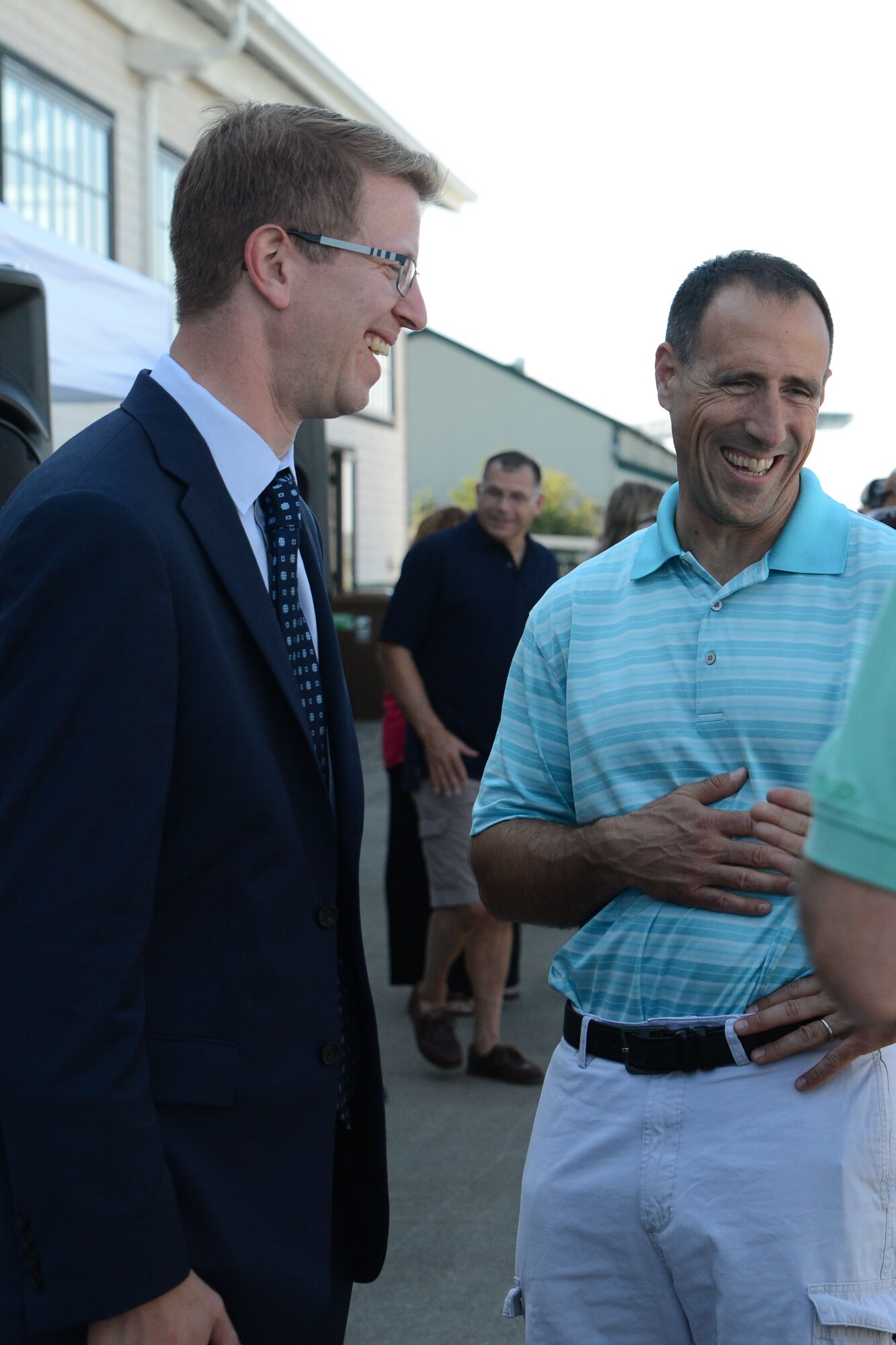 Col. Leonard Kosinski (right), 62nd Airlift Wing commander, laughs with Congressman Derek Kilmer, 6th District of Washington, June 29, 2015, in Tacoma, Wash., during the 2015 Airman Appreciation Day event. Airman Appreciation event, hosted by the Air Force Association, featured free barbeque, drinks, games, face painting and a balloon animalist, and is a way of saying “thank you” to McChord Airmen. (U.S. Air Force photo\Staff Sgt. Katie Jackson) 