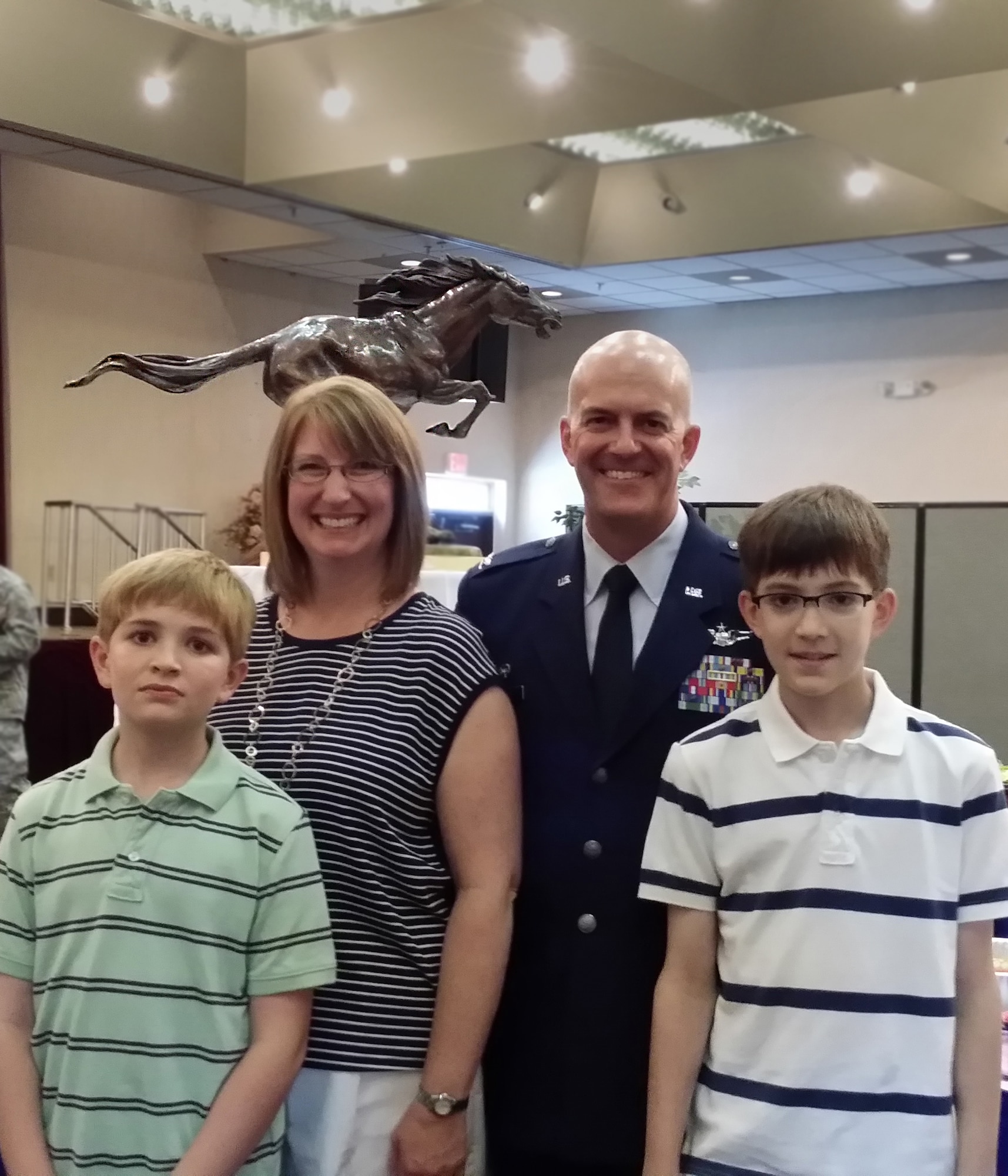 Col. Andrew Hansen, 51st Fighter Wing commander, poses with his wife and children during his change-of-command reception, June 16, 2016 at Osan Air Base, Republic of Korea. Hansen took over command of the 51st FW on June 16 and with it came the title "Mustang 1."  (Courtesy photo)
