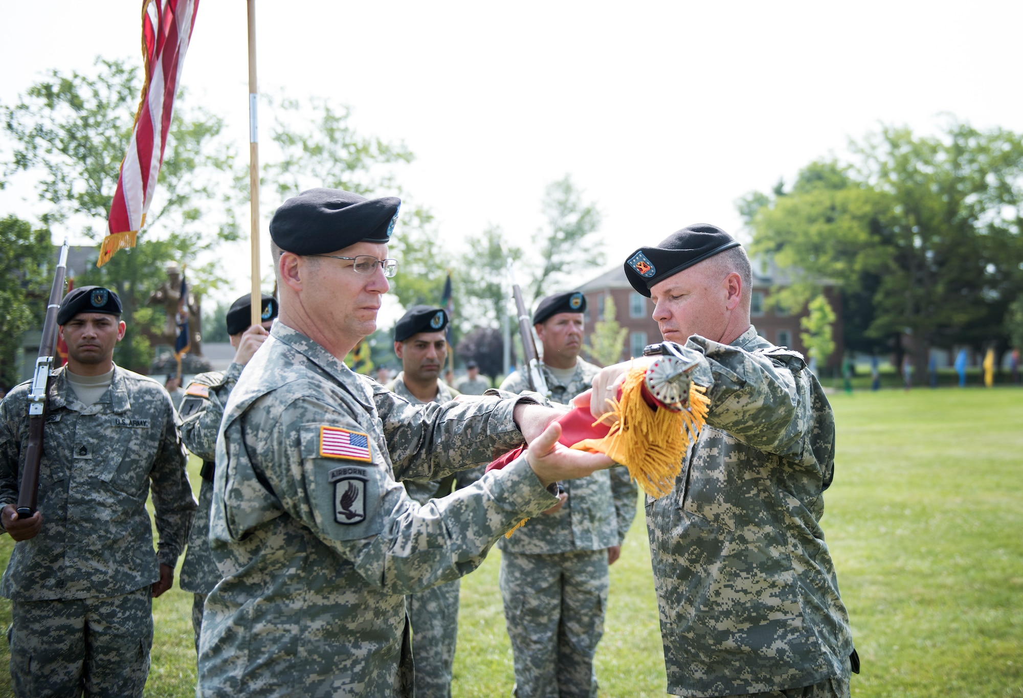 Col. John Lange, 72nd Field Artillery Brigade commander, and the 72nd’s Command Sgt. Maj. Stephen Bower, case the colors during the unit’s deactivation ceremony held June 12, 2015 at Joint Base McGuire-Dix-Lakehurst, N.J. As part of First Army’s Operation Bold Shift, 72nd FA Bde Soldiers are transitioning into the 174th Combined Arms Training Brigade, whose mission is now to provide Reserve and Guard Soldiers pre-mobilization training targeted to their mission at their home station. (U.S. Air Force photo by Staff Sgt. Katherine Tereyama)