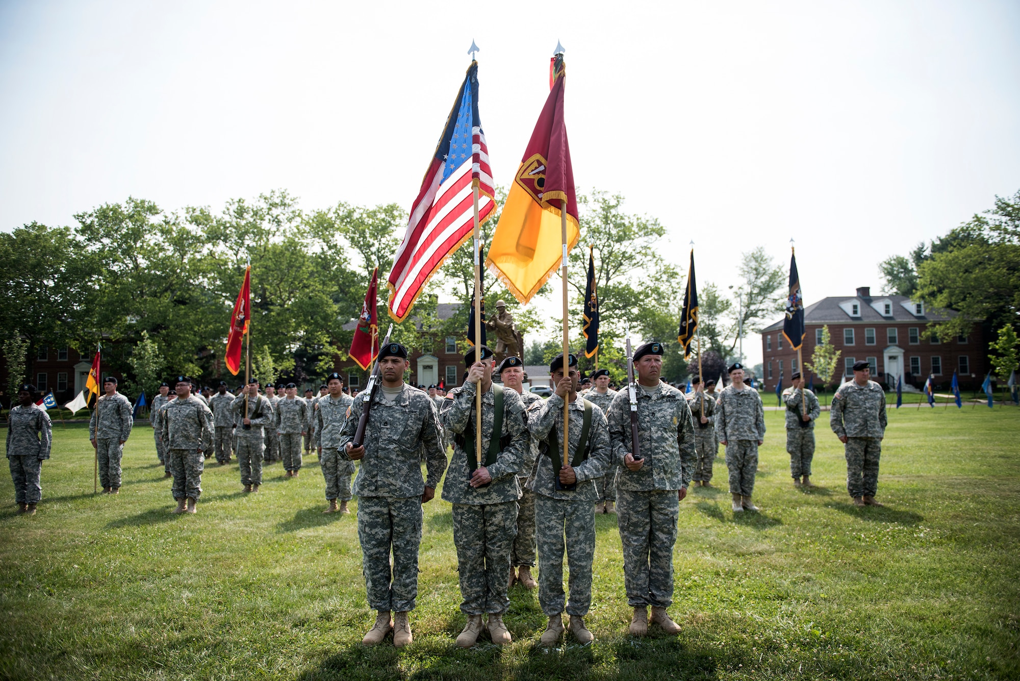 Soldiers of the 72nd Field Artillery Brigade stand in formation beneath “The Ultimate Weapon” statue during the unit’s deactivation ceremony held June 12, 2015 at Joint Base McGuire-Dix-Lakehurst, N.J. Col. John Lange presided over the ceremony as the unit’s final commander before its Soldiers transitioned into the base’s 174th Combined Arms Training Brigade. (U.S. Air Force photo by Staff Sgt. Katherine Tereyama)