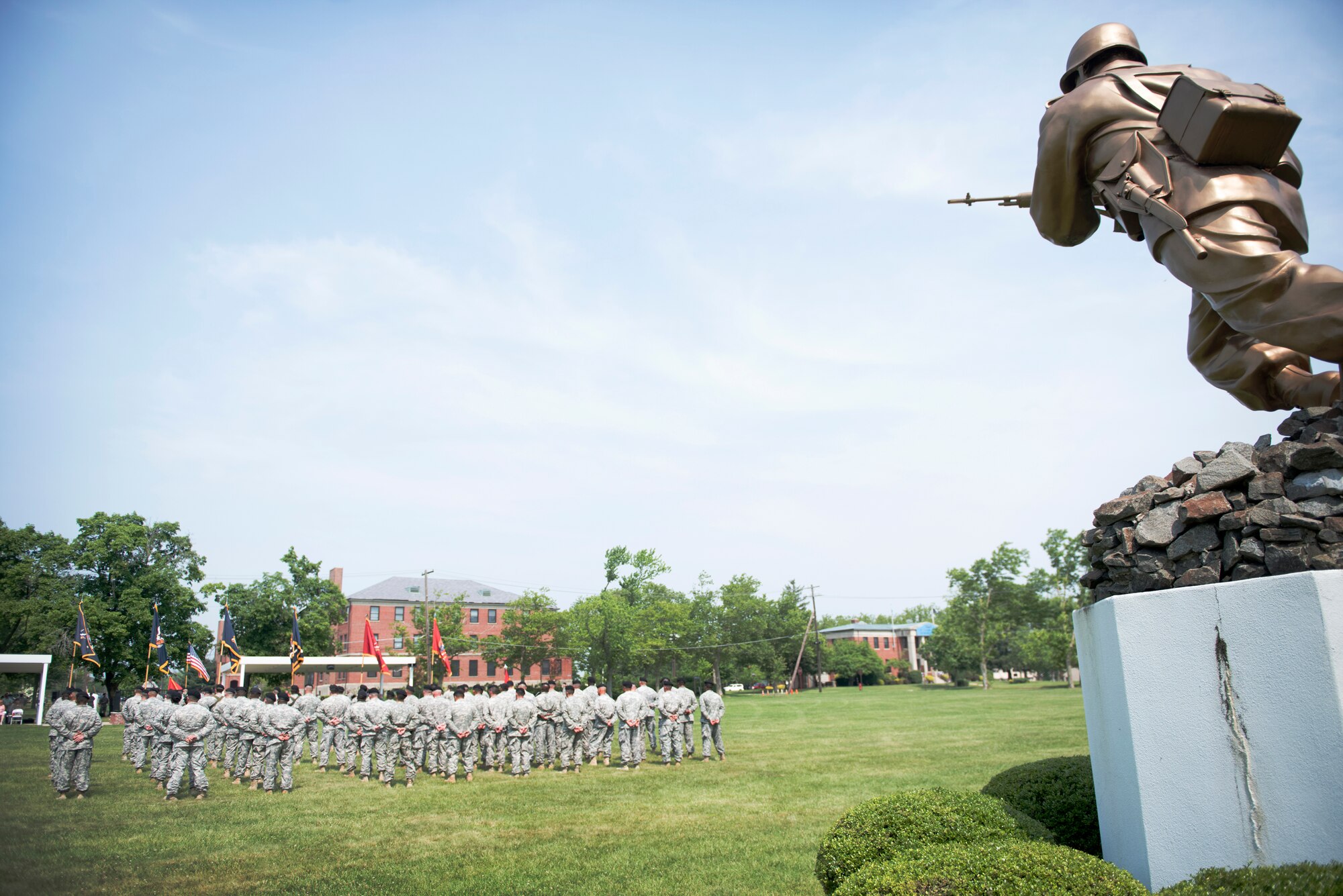 Soldiers of the 72nd Field Artillery Brigade stand in formation beneath “The Ultimate Weapon” statue during the unit’s deactivation ceremony held June 12, 2015 at Joint Base McGuire-Dix-Lakehurst, N.J. Col. John Lange presided over the ceremony as the unit’s final commander before its Soldiers transitioned into the base’s 174th Combined Arms Training Brigade. (U.S. Air Force photo by Staff Sgt. Katherine Tereyama)
