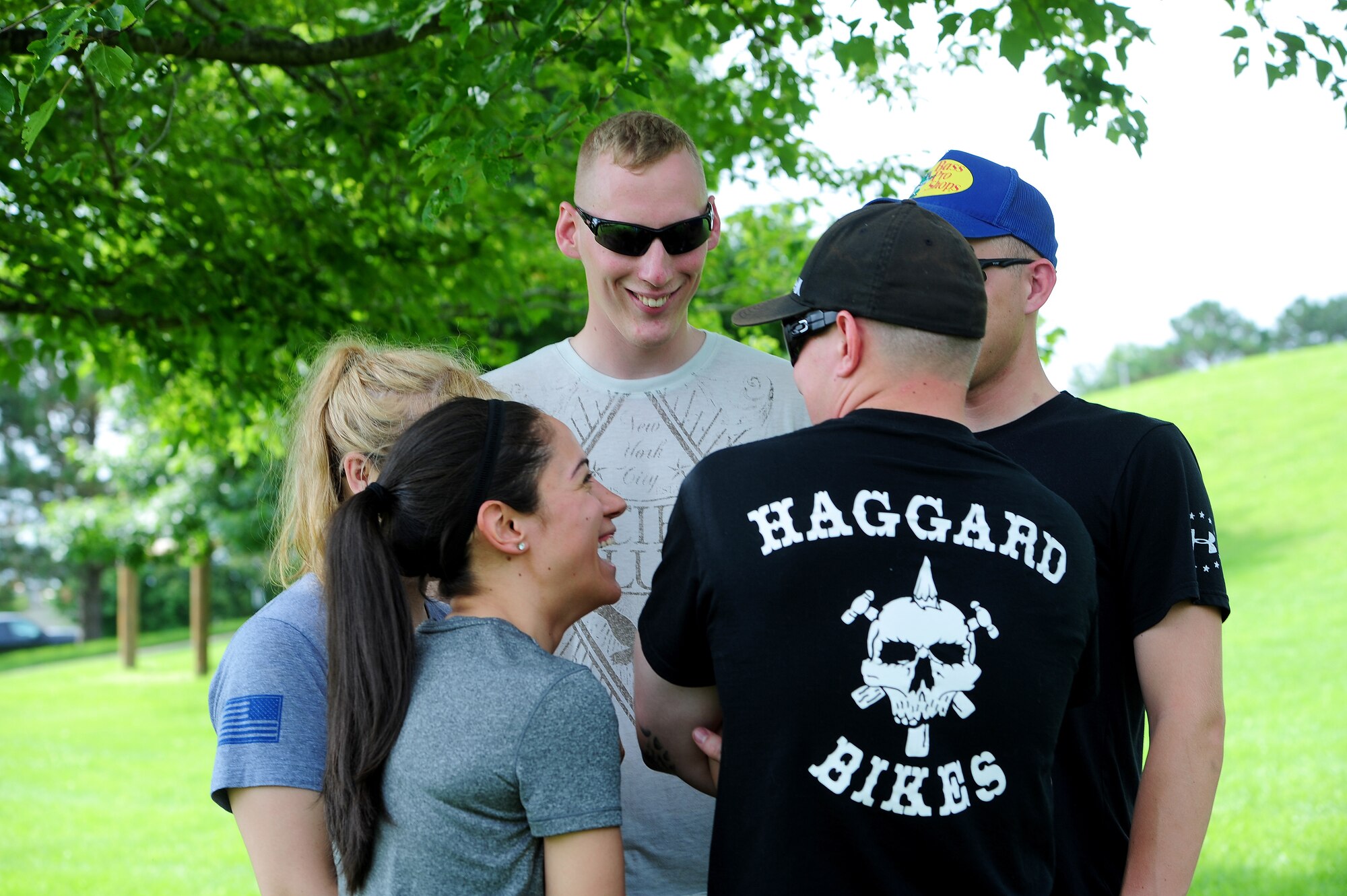 Members from Whiteman Air Force Base, Mo., participate in the “all-aboard” challenge June 17, 2015, as part of the Tucker Leadership Lab in Liberty, Mo. The group tried multiple techniques to try and balance together on a small plank of wood for the duration of a nursery rhyme. (U.S. Air Force photo by Airman 1st Class Jazmin Smith/Released)