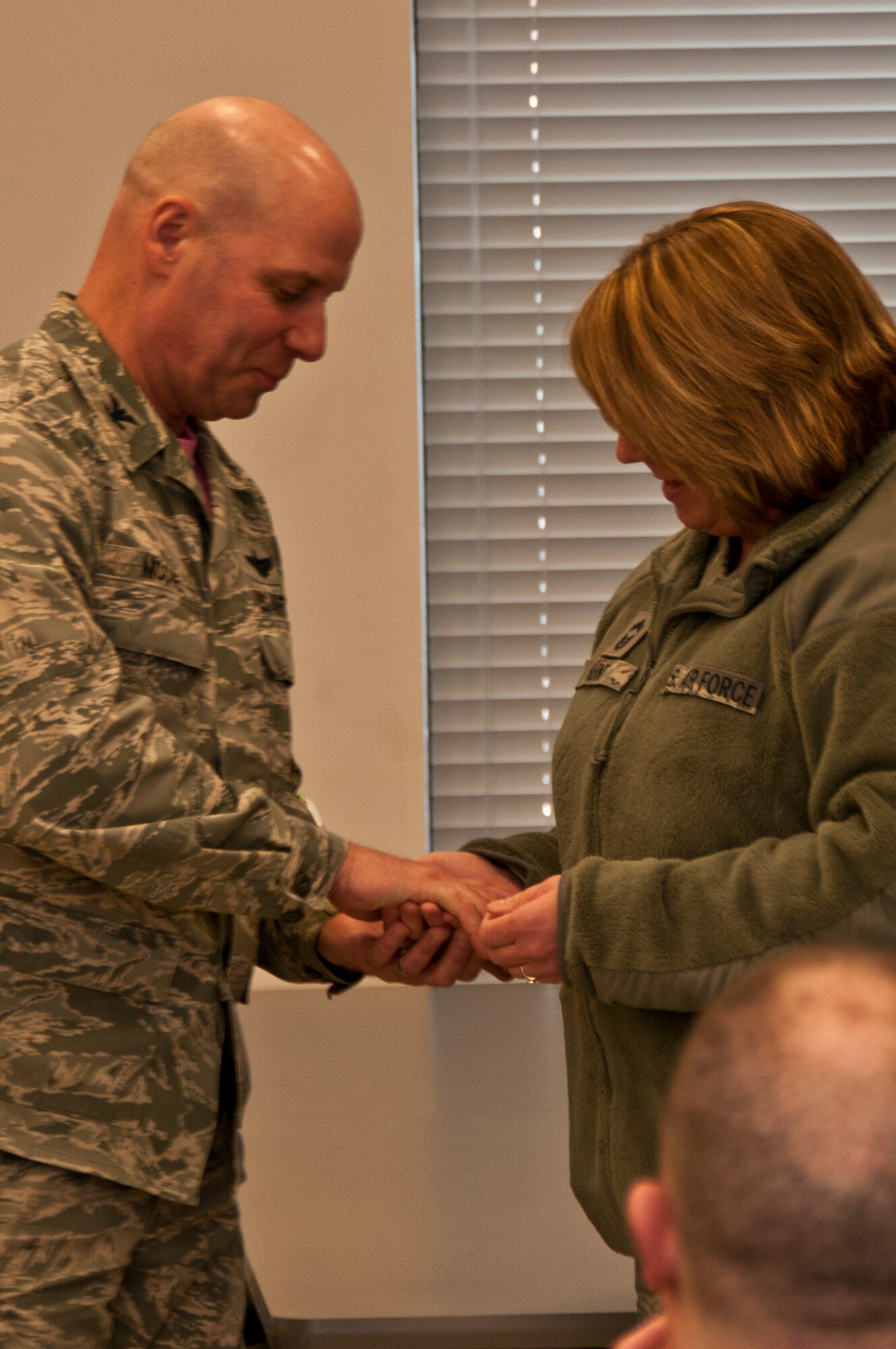 179th Airlift Wing Commander, Col. Gary McCue, recognizes Chief Master Sgt. Wendy Hunt during a retirement luncheon on Mar. 8, 2015, in Mansfield, Ohio. Members gathered to bid farewell to Chief Master Sgt. Wendy Hunt as she retires with 28 years of service in the Ohio Air National Guard. (U.S. Air National Guard Photo by Tech. Sgt. Joe Harwood\Released)