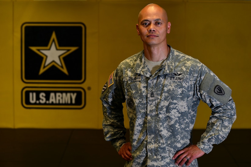 U.S. Army Sgt. 1st Class Michael Craig, Aviation Logistics Noncommissioned Officer Academy branch chief, poses for a photo at the combatives studio at Fort Eustis, Va., June 24, 2015. The Pittsburg, Calif., native, who grew up learning different martial arts, now teaches combatives as part of training at the academy. (U.S. Air Force photo by Staff Sgt. Natasha Stannard/Released)