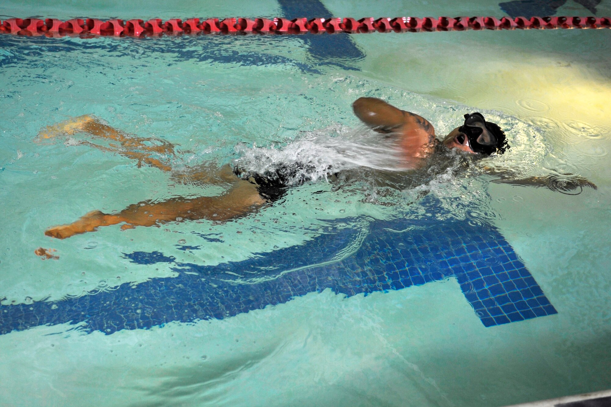 U.S. Air Force Staff Sgt. Arbil Ramos, 633rd Logistics Readiness Squadron unit deployment manager, swims in the Shellbank Fitness Center indoor pool at Langley Air Force Base, Va., July 1, 2015. The Shellbank pool is one of four pools on Joint Base Langley-Eustis. (U.S. Air Force photo by Senior Airman Breonna Veal/Released)