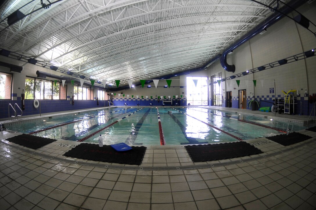 U.S. Service members swim in the Shellbank Fitness Center indoor pool at Langley Air Force Base, Va., July 1, 2015. The indoor pool is open Monday through Friday, 6 a.m. to 10 a.m., 11 a.m. to 1 p.m., and 3 p.m. to 8 p.m. (U.S. Air Force photo by Senior Airman Breonna Veal/Released) 