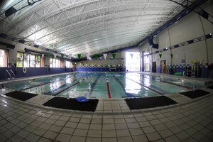 U.S. Service members swim in the Shellbank Fitness Center indoor pool at Langley Air Force Base, Va., July 1, 2015. The indoor pool is open Monday through Friday, 6 a.m. to 10 a.m., 11 a.m. to 1 p.m., and 3 p.m. to 8 p.m. (U.S. Air Force photo by Senior Airman Breonna Veal/Released) 