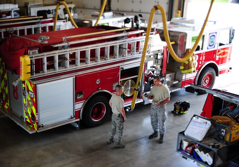 U.S. Air Force Staff Sgts. Nathan Silk, right, and Jason Lopez, 509th Civil Engineer Squadron firefighters, inventory equipment at Whiteman Air Force Base, Mo., May 28, 2015. Keeping inventory is important to ensure equipment is accounted for in order to perform daily duties. (U.S. Air Force photo by Senior Airman Keenan Berry/Released)