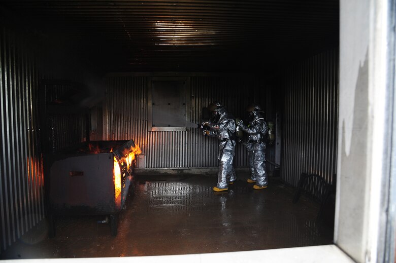 Airmen from the 509th Civil Engineer Squadron engage in a structural exercise at Whiteman Air Force Base, Mo., May 28, 2015. Firefighters establish trust in one another to ensure everyone’s safety is accounted for and each member returns in one piece. (U.S. Air Force photo by Senior Airman Keenan Berry/Released)
