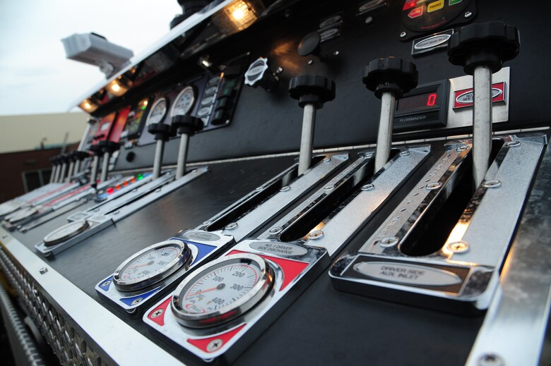 The pump panel of a fire truck remains available for emergencies at Whiteman Air Force Base, Mo., May 28, 2015. The pump panel is used to direct water flow to the appropriate hose lines. (U.S. Air Force photo by Senior Airman Keenan Berry/Released)
